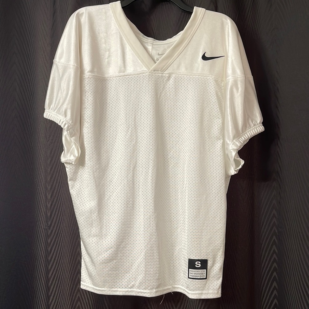Nike size small jersey. See pictures! Few small snagged spots.